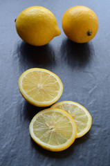 Fresh lemons on a dark background