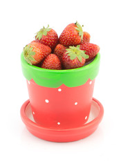 Fresh strawberry in pot isolated on white background