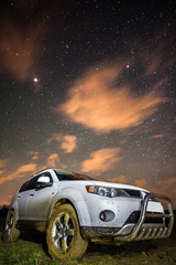 Fototapeta na wymiar Muddy car with stars above