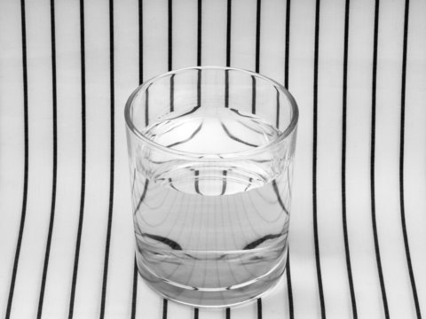 Glass of water. Symmetry, refraction.