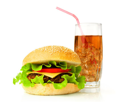 Big hamburger and cola with ice cubes