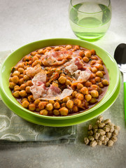 chickpeas soup with bacon and tomato sauce