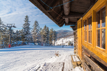 Mountain hut in Wierchomla ski area on sunny winter day, Poland