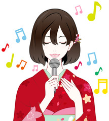 着物の女性　歌う