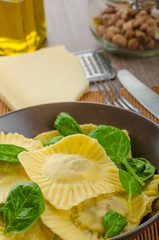 Homemade ravioli stuffed with spinach and ricotta