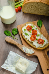 Fresh bread smeared with cream cheese