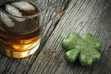 Glass of Whiskey and Clovers to celebrate St Patrick's Day