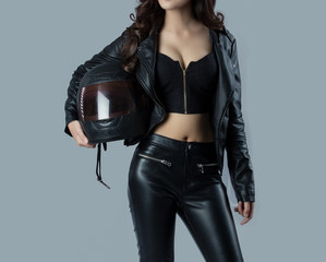 Fototapeta na wymiar beautiful female biker wearing a leather jacket