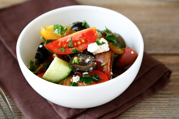 Fresh salad with vegetables and cottage cheese in a bowl