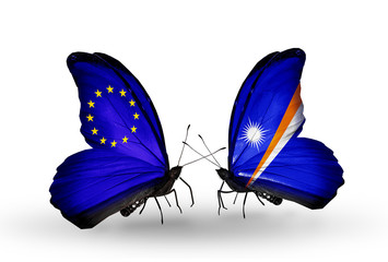 Fototapeta na wymiar Two butterflies with flags EU and Marshall islands
