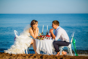 happy bride and groom on the beach