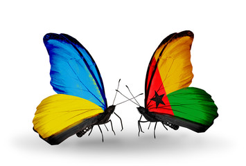 Two butterflies with flags Ukraine and Guinea Bissau