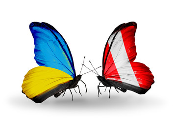 Two butterflies with flags Ukraine and Peru