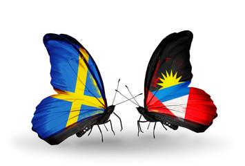 Two butterflies with flags Sweden and Antigua and Barbuda