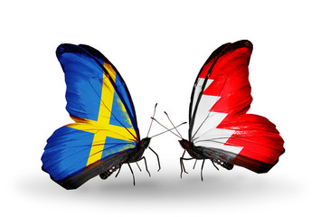 Two butterflies with flags  Sweden and Bahrain