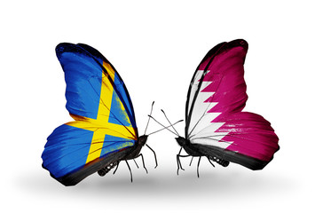 Two butterflies with flags Sweden and Qatar