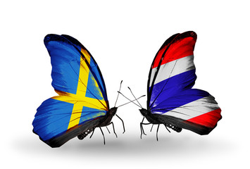 Two butterflies with flags Sweden and  Thailand