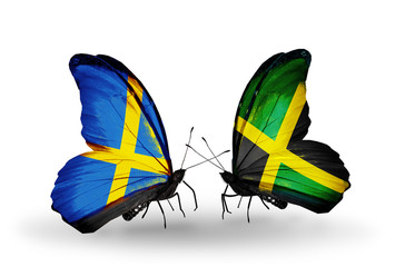 Fototapeta na wymiar Two butterflies with flags Sweden and Jamaica
