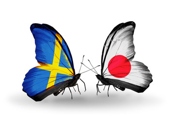 Two butterflies with flags Sweden and Japan