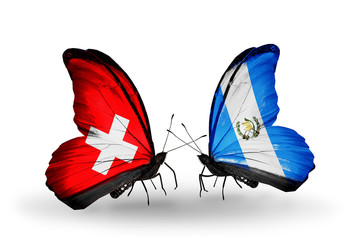 Two butterflies with flags Switzerland and Guatemala