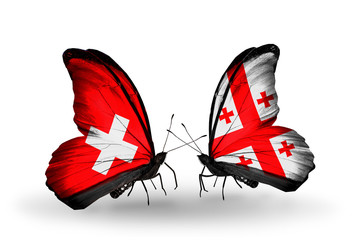 Two butterflies with flags Switzerland and Georgia