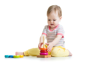 toddler child playing with color pyramid toy