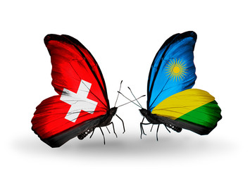 Two butterflies with flags Switzerland and Rwanda