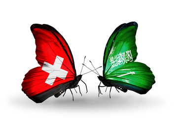 Two butterflies with flags Switzerland and Saudi Arabia