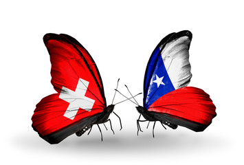 Two butterflies with flags Switzerland and Chile