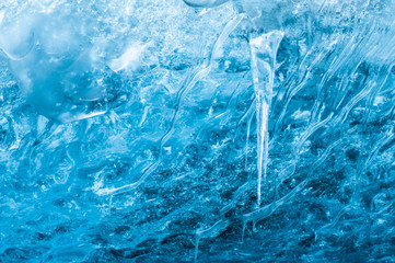 An Icicle hanging from the glacier wall - obrazy, fototapety, plakaty