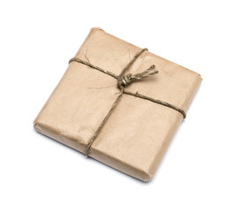 parcel wrapped with brown kraft paper isolated on white backgrou
