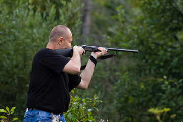 the shooter aiming from a gun at target