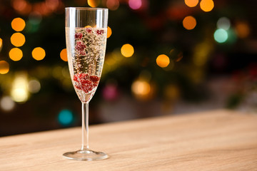Glass full of champagne with cranberries