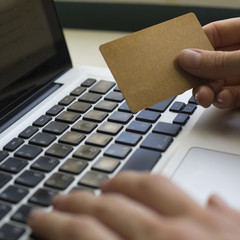 Сredit card in hand for online shopping