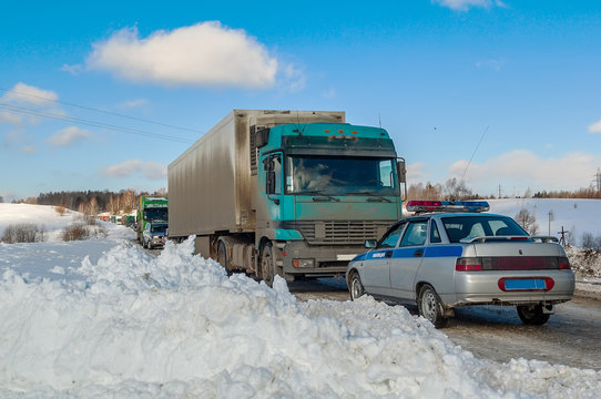 Trucks stopped on highway after heavy snow storm
