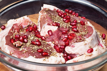 Preparation of lamb with pomegranate in the kitchen