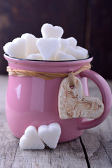 pink mug with sugar hearts
