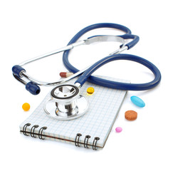 stethoscope and notebook on white