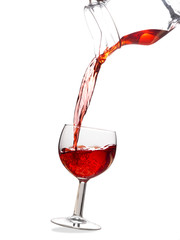 Fruit cordial drink, pouring. White background.