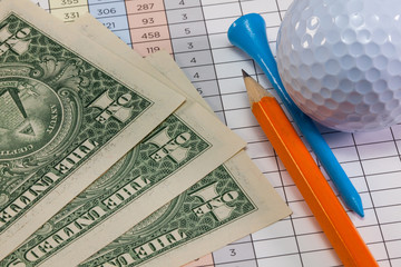Golf equipments and US dollar banknotes