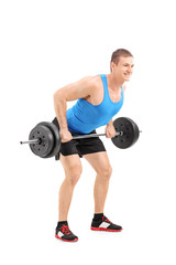 Fototapeta na wymiar Full length portrait of a muscular bodybuilder lifting a weight