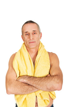 Mature man holding towel around neck