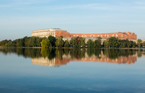 The Congress Hall reflected in still lake in Nuremberg