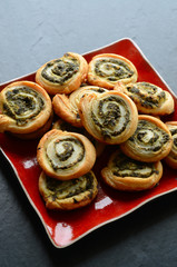 Puff pastry rolls with spinach and greek cheese filling