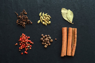 Mix of spices on a stone background