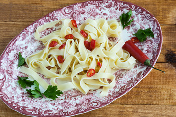 Fettuccini  Italian pasta with parsley and hot peppers