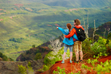 Two hikers relaxing enjoying the amazing view