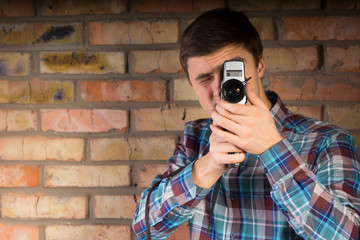 Young Man Capturing Something Using Camera