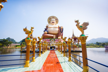 Smiling Buddha of wealth statue on Koh Samui, Thailand