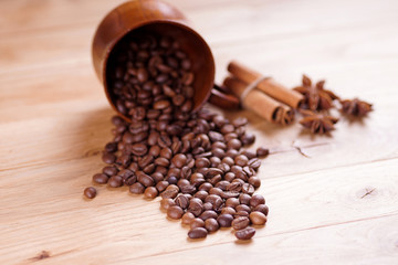 spilled coffee beans on oak